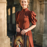 Catholight  A Testament of Grace and Compassion Leather Bag